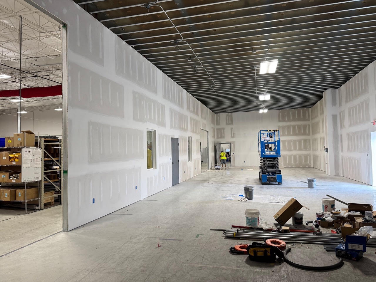 A long new room under construction at Teknoware, its walls taped and the steel deck ceiling exposed