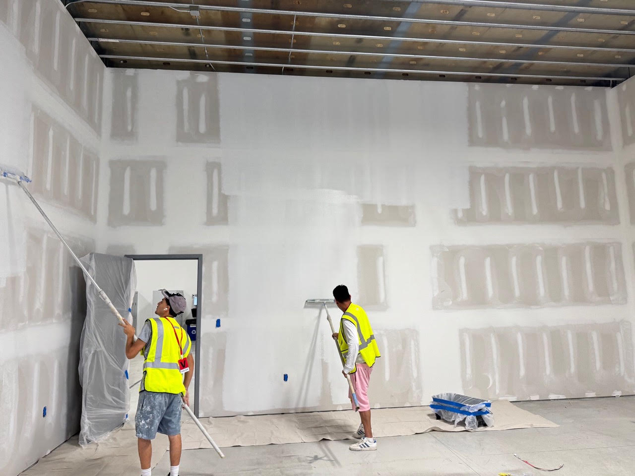Crew finishing new drywall at Teknoware