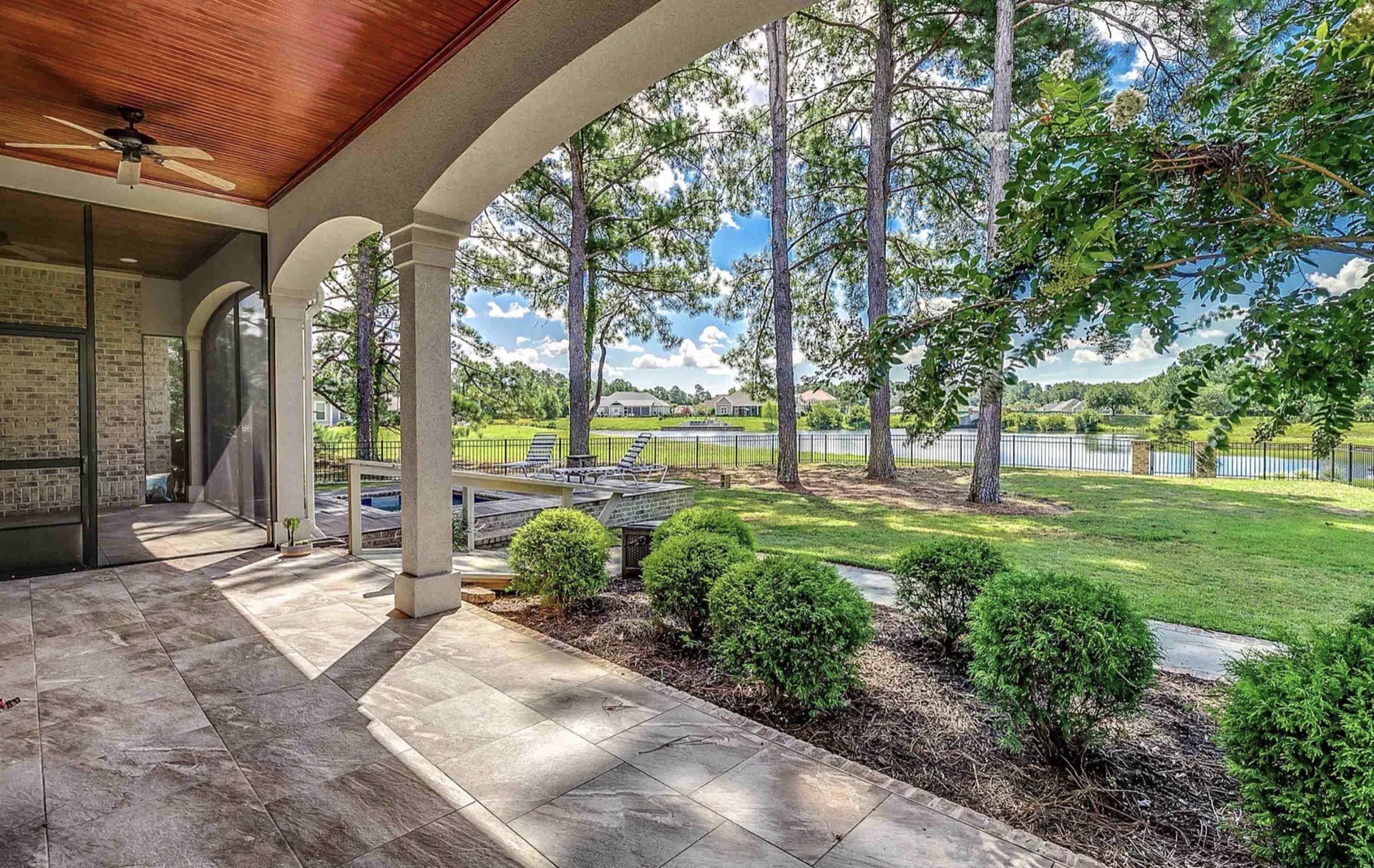 Covered porch overlooking the landscape at 1025 Muscovy